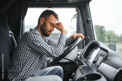 Man trucker tired driving in a cabin of his truck