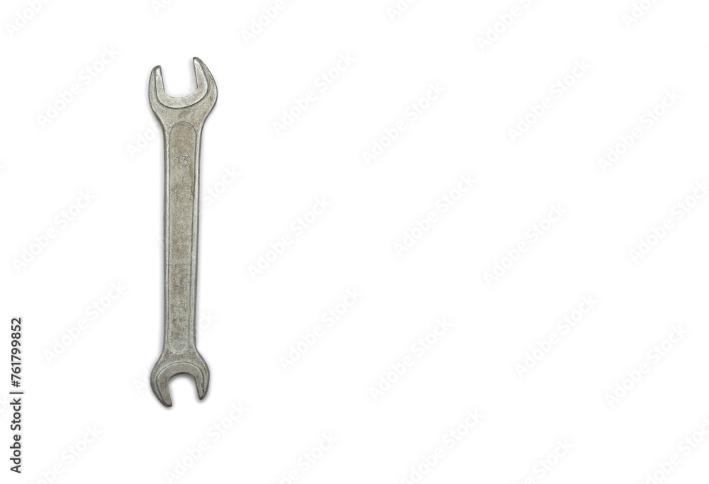 Wrench isolated on white background with free space for text. One hand tool top view. A small not new metal wrench Wrench isolated on white background with free space for text. One hand tool top view. A small not new metal wrench