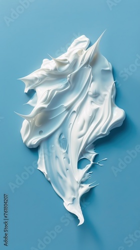 White cream smear on a blue background