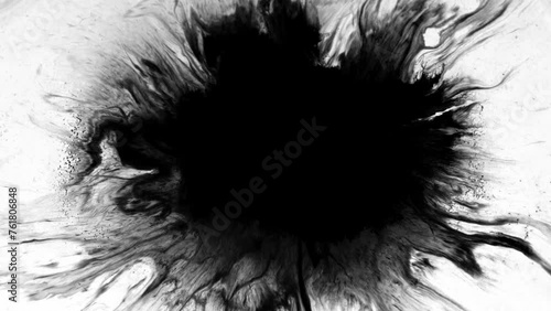 Abstract ink splatter paint in black and white recoloring .dropTurbulent painting blot spreading from the center in this contemporary reveal 3D animation. 4K background, VFX overlay, alpha matte blend