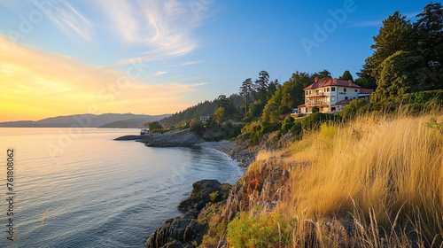 Breathtaking Sunset View of a Secluded House Nestled Amidst Nature, Overlooking the Calm Ocean Waters and Distant Mountains