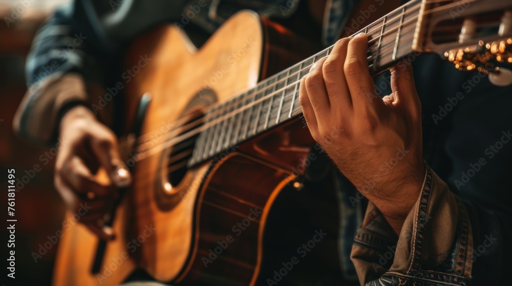 Detailed view of a guitarist strumming an acoustic guitar, emphasizing the movement and harmony of music
