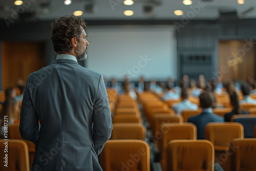 Speaker Preparing for a Conference in an Auditorium