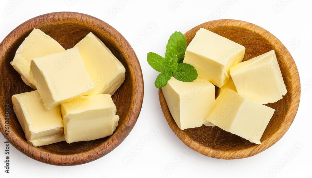 butter cubes in wooden bowl isolated on white background with clipping path and full depth of field top view flat lay