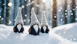 three cute gnomes in the snowdrift in the winter forest in snowfall
