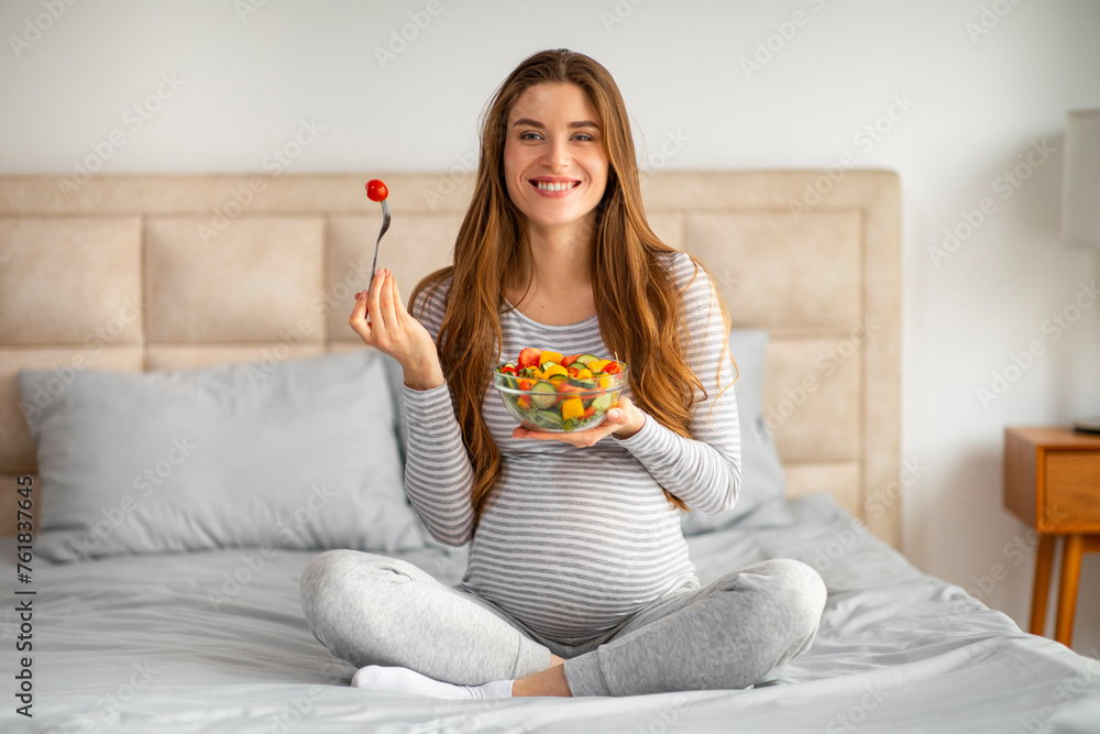 Pregnancy Diet. Beautiful Young Pregnant Woman Holding Bowl With Fresh Vegetable Salad Pregnancy Diet. Beautiful Young Pregnant Woman Holding Bowl With Fresh Vegetable Salad