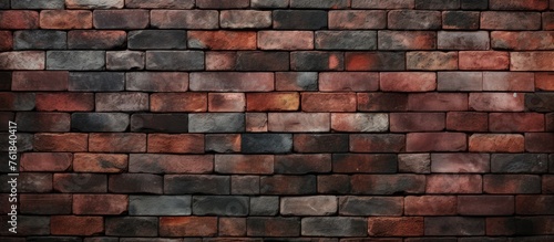 A close up of a brown brick wall showcasing the intricate pattern of rectangular bricks. The brickwork represents a beautiful art form and composite material used for building flooring with symmetry