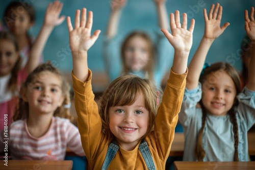 A group of children are in a classroom and one of them is raising their hand