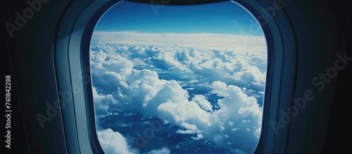 View of clouds and sky through airplane window