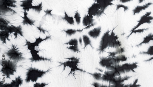 Abstract tie dyed fabric of black and white color on white cotton. Hand painted fabrics. Shibori dyeing photo