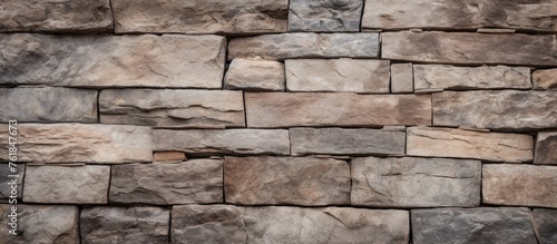 A detailed shot of a brown brick wall showcasing the rectangular shape of each brick, a classic building material made of composite materials like stone, rock, or wood