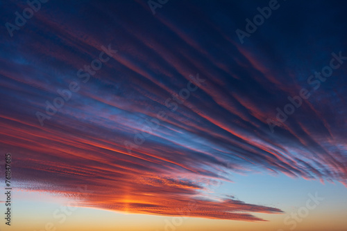 Obraz na płótnie Stunningly beautiful multi-colored violet-pink-lilac evening sky, multi-colored clouds fan out from the lower horizon w salonie