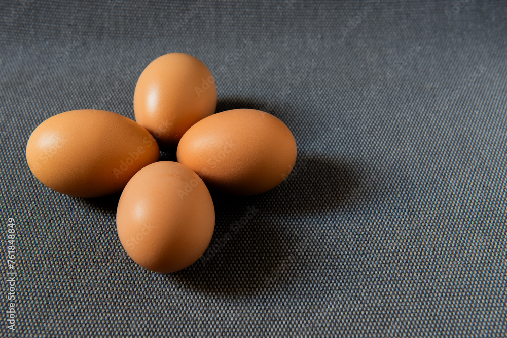Fresh brown chicken eggs on grey background. Fresh brown chicken eggs on grey background.