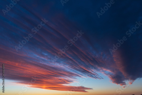Obraz na płótnie Stunningly beautiful multi-colored violet-pink-lilac evening sky, multi-colored clouds fan out from the lower horizon w salonie