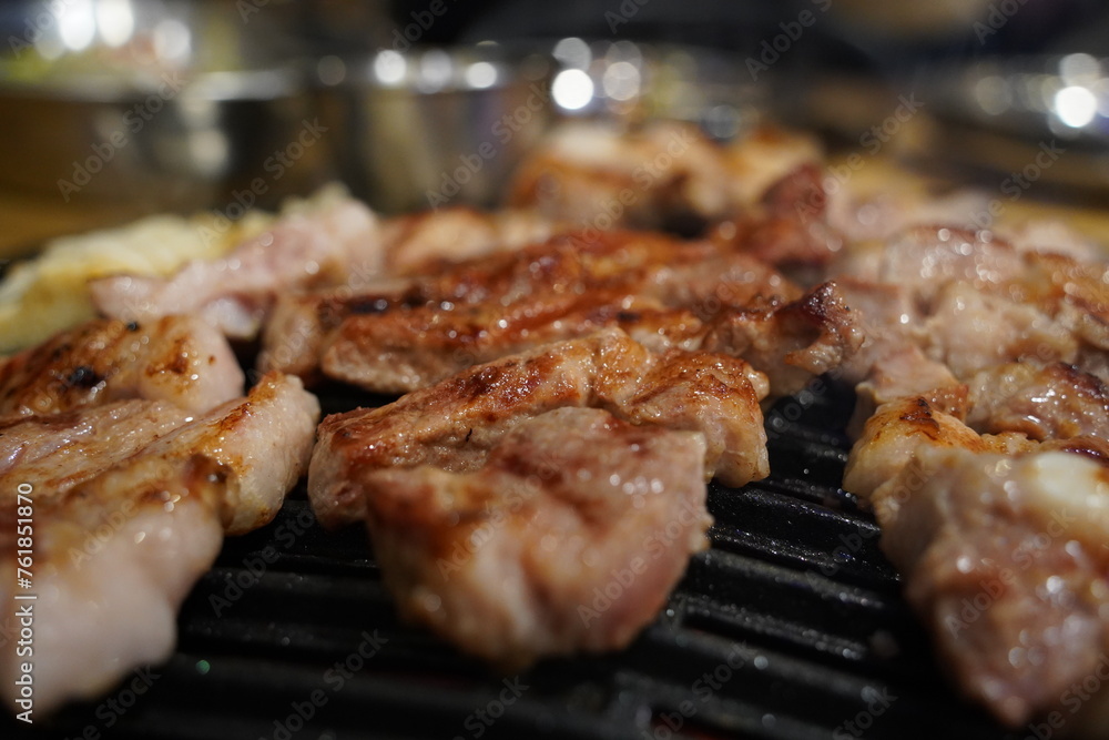 Grilled pork belly on the grill in the restaurant