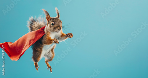 flying squirrel with a superhero cape on blue background photo