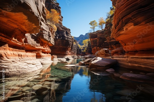 A river flows through a canyon, surrounded by bedrock and towering mountains
