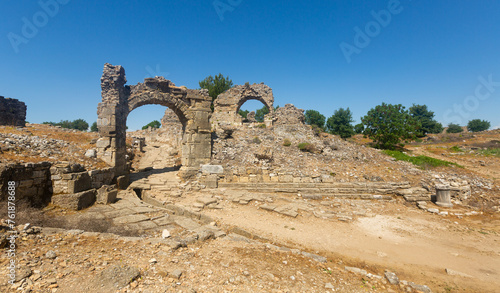 Ruins of antique Aspendos East Gate and city quarters, Turkey