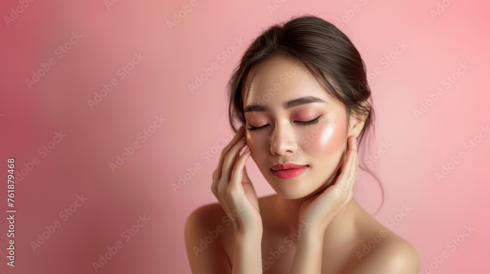 Fototapeta premium Asian Serene Beauty with Perfect Skin on Pink Background