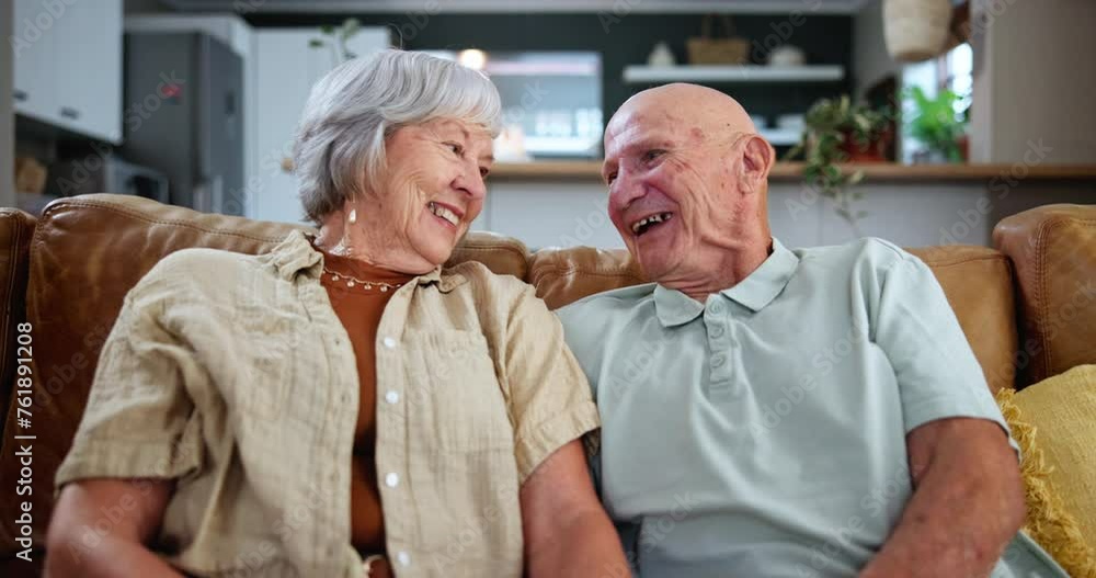 Smile, relax and senior couple watching tv together on sofa in living room of home for retirement. Television, movie or streaming service with happy elderly man and woman in apartment for bonding Smile, relax and senior couple watching tv together on sofa in living room of home for retirement. Television, movie or streaming service with happy elderly man and woman in apartment for bonding