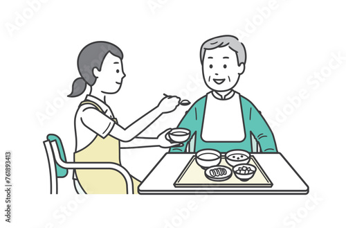 食事介助をする介護士と高齢男性のイラスト
