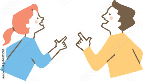 指を差して上を向いている男性と女性_色