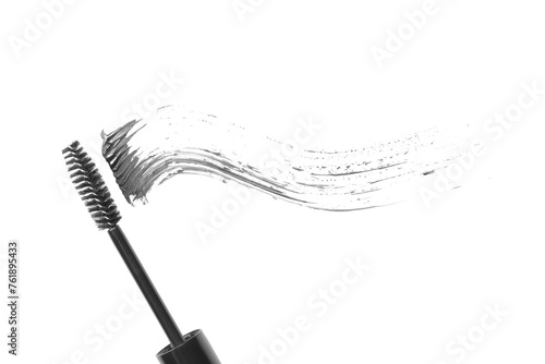 Smear of mascara and applicator isolated on white, top view