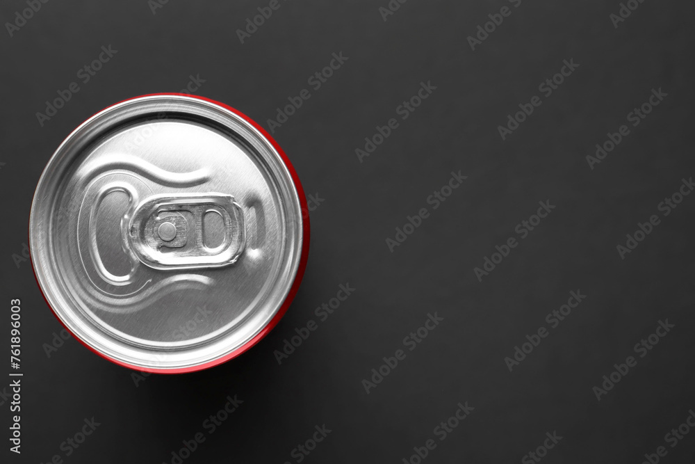 Energy drink in can on black background, top view. Space for text Energy drink in can on black background, top view. Space for text