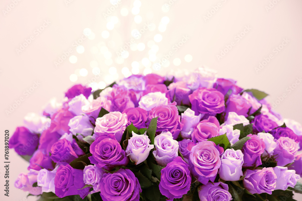 Bouquet of violet roses against blurred background, closeup. Funeral attributes Bouquet of violet roses against blurred background, closeup. Funeral attributes