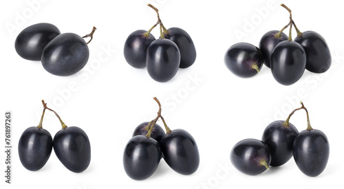 Delicious fresh dark blue grapes isolated on white, set