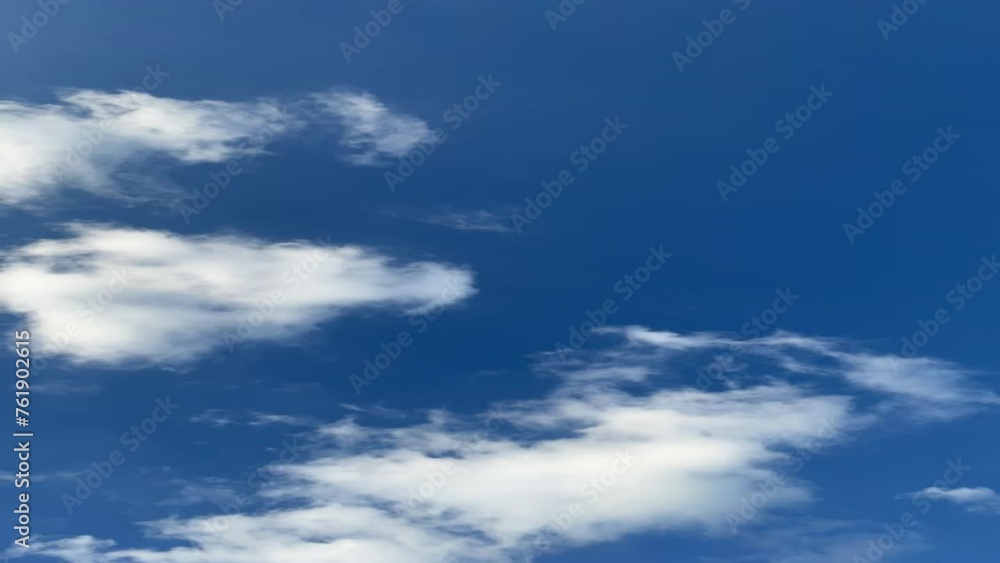 Time lapse of white clouds moving quickly against the backdrop of the blue sky. Time lapse of white clouds moving quickly against the backdrop of the blue sky.