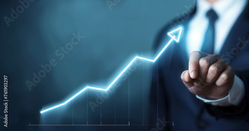 Businessman Interacting with Glowing Growth Arrow on Virtual Screen. Development and growth concept.