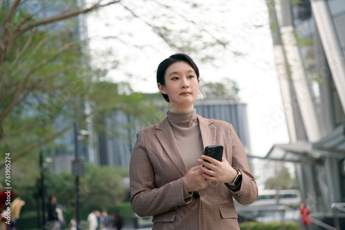 Young Professional Woman Using Smartphone in the City