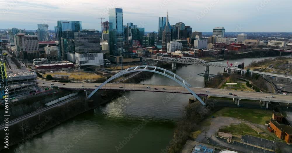 Korean Veterans Memorial Bridge And John Seigenthaler Pedestrian Bridge Over Cumberland River In Nashville, Tennessee, USA. - aerial shot Korean Veterans Memorial Bridge And John Seigenthaler Pedestrian Bridge Over Cumberland River In Nashville, Tennessee, USA. - aerial shot