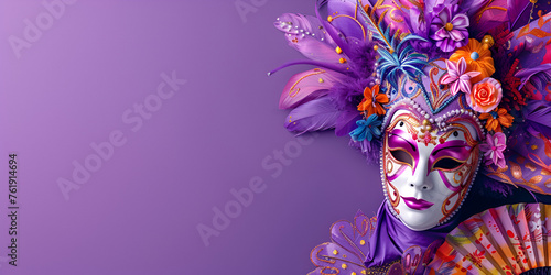 Beautiful Venetian mask with feathers on a dark background.
