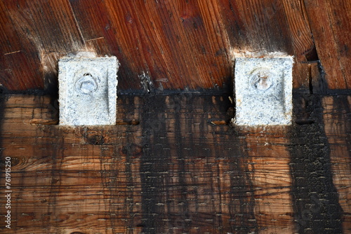 Galvanic corrosion on metal brackets. White powdery residue.