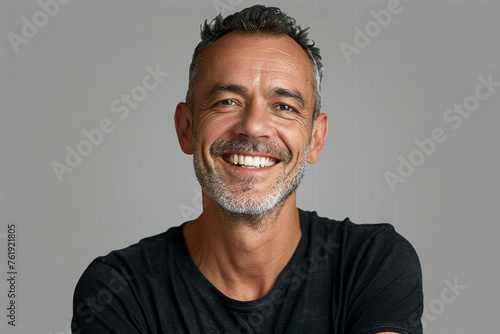 portrait of a smiling man isolated on grey background