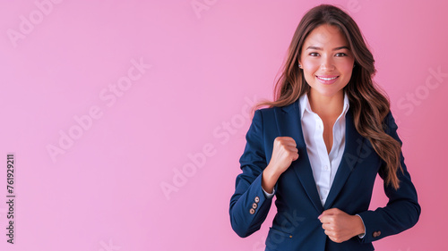 Hispanic businesswoman smiling in formal white blue suit clenched fist