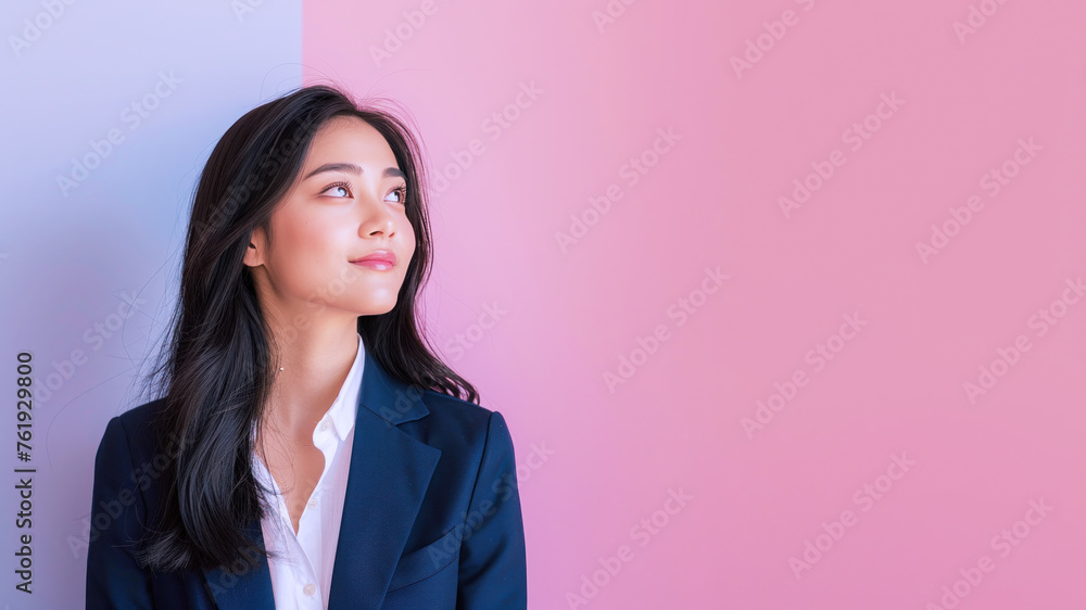 Malay businesswoman smile in formal white blue suit look up side view Malay businesswoman smile in formal white blue suit look up side view