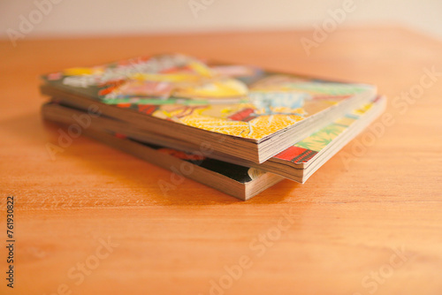 comic books on wooden table selective focus