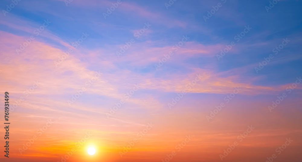 Colorful sunrise sky in the morning with orange sunlight clouds on idyllic horizontal sky background. Beautiful dramatic sunset in golden hour time