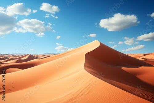 Sand dunes in the desert under a blue sky, creating a stunning natural landscape