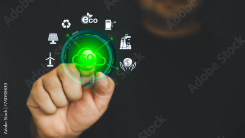 Hand points to a touchscreen CO2 icons and an icon renewable energy for reduce CO2 emission on virtual screen, net zero carbon, global warming, green fuel and earth protect