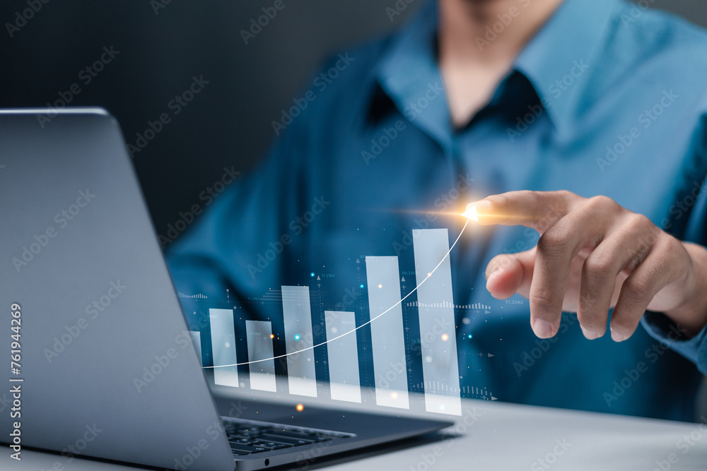 Increasing income financial chart. Businessman use laptop to analyzing ...