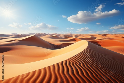 A natural landscape of sandy dunes under a blue sky in the desert