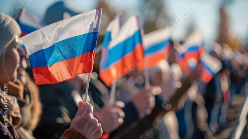 Celebratory Russians Waving Flags at Autumn National Day Rally photo
