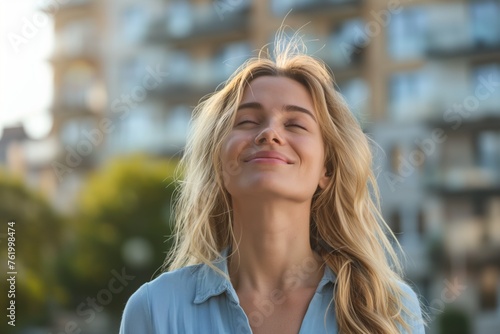 Contented young woman enjoying a moment of serenity in urban surroundings, concept of mindfulness and urban well-being