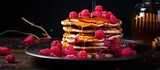 Pancakes with sweet syrup and fruits on top