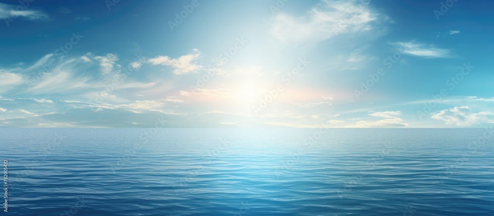 Tranquil Seascape with Fluffy Clouds and Radiant Sun Over Blue Ocean Horizon