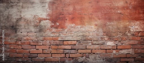 Old brick wall with red paint